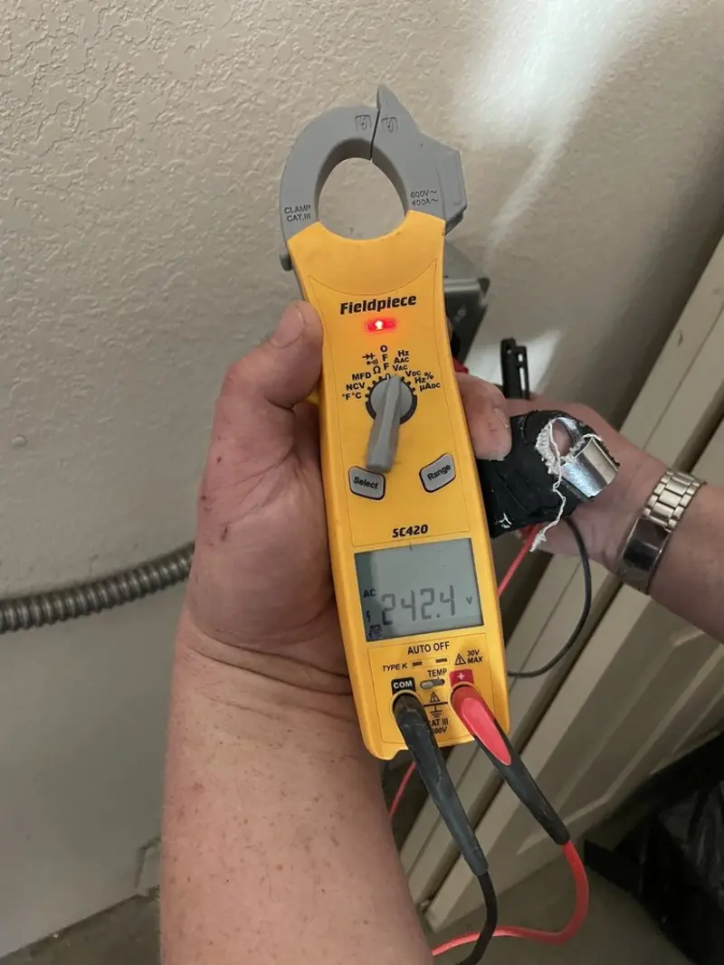 Voltage testing with clamp meter during Electrical Installation Services in Chester